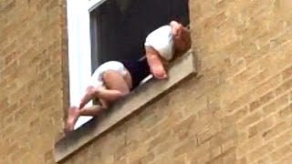 Strangers Pitch In to Save Toddlers Dangling Out Chicago Window [upl. by Metsky]