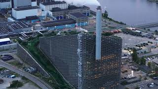 Aerial views highlight the Amager Bakke waste to energy plant in Copenhagen Denmark showcasing its [upl. by Kyne]