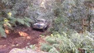 Land Rover perentie crawls up muddy hill climb [upl. by Muir187]