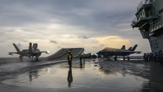 Jets fly from HMS Queen Elizabeth in rainy conditions in the Bay of Bengal [upl. by Ellebana]