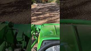 John Deere 1026r grading up a 20 slope [upl. by Arrat64]