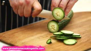 Chopping a cucumber  Jamie Olivers Home Cooking Skills [upl. by Aynor]