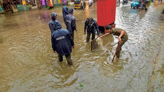 Clearing the Way Unclogging Flooded Street Drains for Flood Control [upl. by Hentrich964]