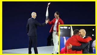 Zinedine Zidane passes torch to Rafael Nadal during starstudded Paris Olympics 2024 openingceremony [upl. by Elkraps]