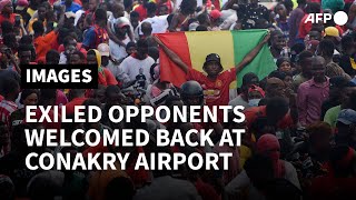 Supporters greet exiled opponents arriving at Conakry airport after fall of Conde  AFP [upl. by Edward253]