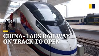 Laos takes delivery of train as new Chinafunded Belt and Road railway nears completion [upl. by Nosak]