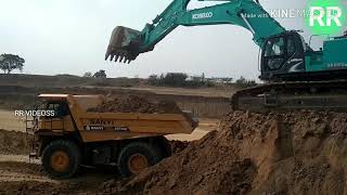 KOBELCO SK850 LOADING SANYI SRT55D [upl. by Adnovaj]