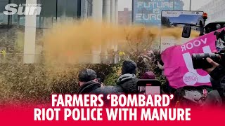 Protesting farmers bombard riot police with manure as they clash in Brussels [upl. by Tannenbaum]