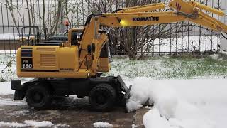 Komatsu Fumotec PW18010  ploughing snow with shield [upl. by Kentiga]