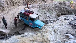 Jeep crossing creek that washed out roadPakistani Glacial Crossing [upl. by Hardan]