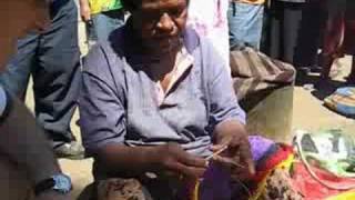 Woman knits a Billum traditional bag in Papua New Guinea [upl. by Llerref]