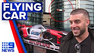 Crane lifts McLaren up 57 floors into 39m penthouse in Melbourne  9 News Australia [upl. by Dorette]