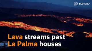 Lava streams past La Palma houses [upl. by Rolanda690]