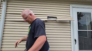 How to remove a piece of vinyl siding  Removal of the old range vent ducting [upl. by Llevol]