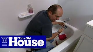 How to Clear a Clogged Bathtub Drain  This Old House [upl. by Annoek8]