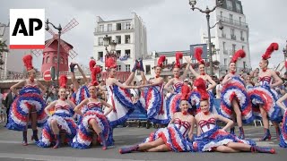 Moulin Rouge dancers perform for cyclists in the Olympics road race [upl. by Ikkaj]