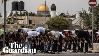 Palestinians pray outside as Israel tightens security around alAqsa mosque [upl. by Yanehs]