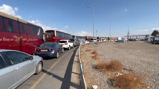 US and NGO vehicles in long queue at Allenby Bridge crossing from Israel into Jordan [upl. by Onez305]