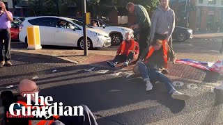 Motorists and paramedic crew drag away Insulate Britain protesters on Wandsworth Bridge [upl. by Jenkins]