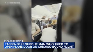 Man ducttaped on flight to Chicago after trying to open door passengers say [upl. by Aitahs]