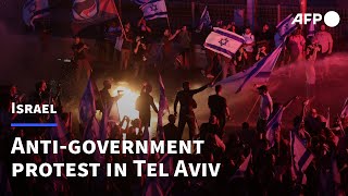 Protesters and police clash as thousands block highway in Tel Aviv  AFP [upl. by Berkshire]