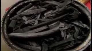 Biochar production in a woodstove [upl. by Ardeen]