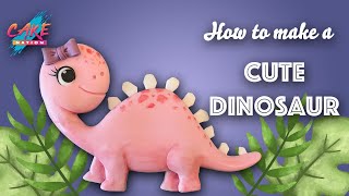 CAKE NATION  How To Make a Cute Fondant Dinosaur Cake Topper [upl. by Yenrab]