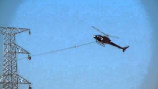 helicopter doing a power line pull at Karra mining operation western australiaMOV [upl. by Wilburn]