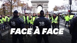 Les images des heurts entre gilets jaunes et police sur les ChampsElysées [upl. by Ahsiryt]