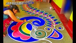 Diwali Special full floor Big Peacock Rangoli designs by Art Gallery [upl. by Esilec]