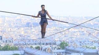 Hanging by a thread Tightrope walker achieves 35m high stunt in Paris [upl. by Enahsed464]