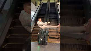 Guy is spinning on the handrails of an escalator shorts [upl. by Sands]