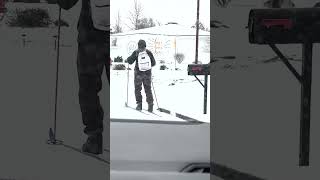 Person Uses Skis to Traverse Snow Covered Streets  1481678 [upl. by Iphigeniah562]