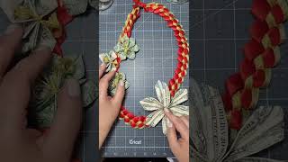 Attach money flowers to a ribbon lei [upl. by Tereb527]