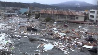 Tsunami in Kesennuma city ascending the Okawa river [upl. by Mollie]