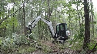 58 Bobcat E45 Clearing Burning Stump Removal [upl. by Suoinuj474]