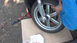 FRONT WHEEL REMOVAL INSTALLATION APRILIA SPORTCITY 125 [upl. by Caniff]