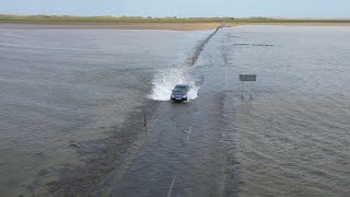 Mercedes tries to cross Holy Island causeway as it floods [upl. by Ydnir703]