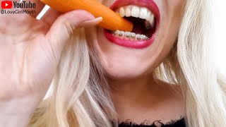 Girl with beautiful teeth and braces chews a hard carrot with open mouth eating openmouthsounds [upl. by Eimak530]