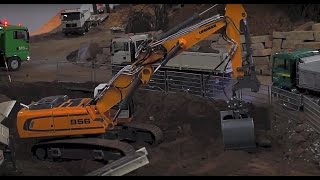 RC Excavator Liebherr 956 offset boom with clamshell bucket loads MAN 8x8  sieving plant [upl. by Hubbard]