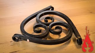 Blacksmithing  Forging a trivet [upl. by Anahpets]