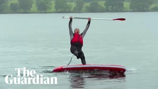 Liberal Democrat leader Ed Davey slips off paddleboard into lake [upl. by Scarlett]