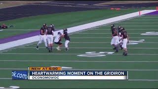 Opposing player lets Wisconsin boy with Down syndrome make his first tackle in football game [upl. by Amyas713]