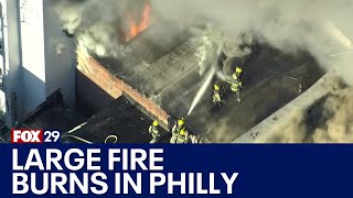 Firefighters battle large fire in Philadelphia [upl. by Nomrac]