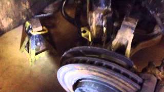 Volvo V70XC Front Strut Removal  Broken Coil Spring [upl. by Aiciram]