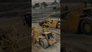 Scrapers working in push pull configuration dozers dumptruck bulldozers [upl. by Eceryt]