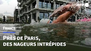 Nager dans la Seine  Des pionniers profitent déjà de la nage en eau libre près de Paris  AFP [upl. by Polard]