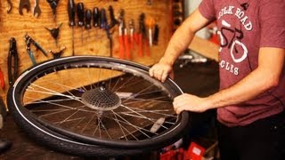 How to Put on New Bike Tire amp Tube  Bicycle Repair [upl. by Arenahs]