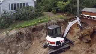 Bobcat E45 Digging Up Big Stump [upl. by Simone]