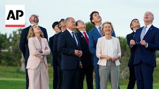 G7 leaders mingle with each other watch parachute display at Italy summit [upl. by Nauqat]